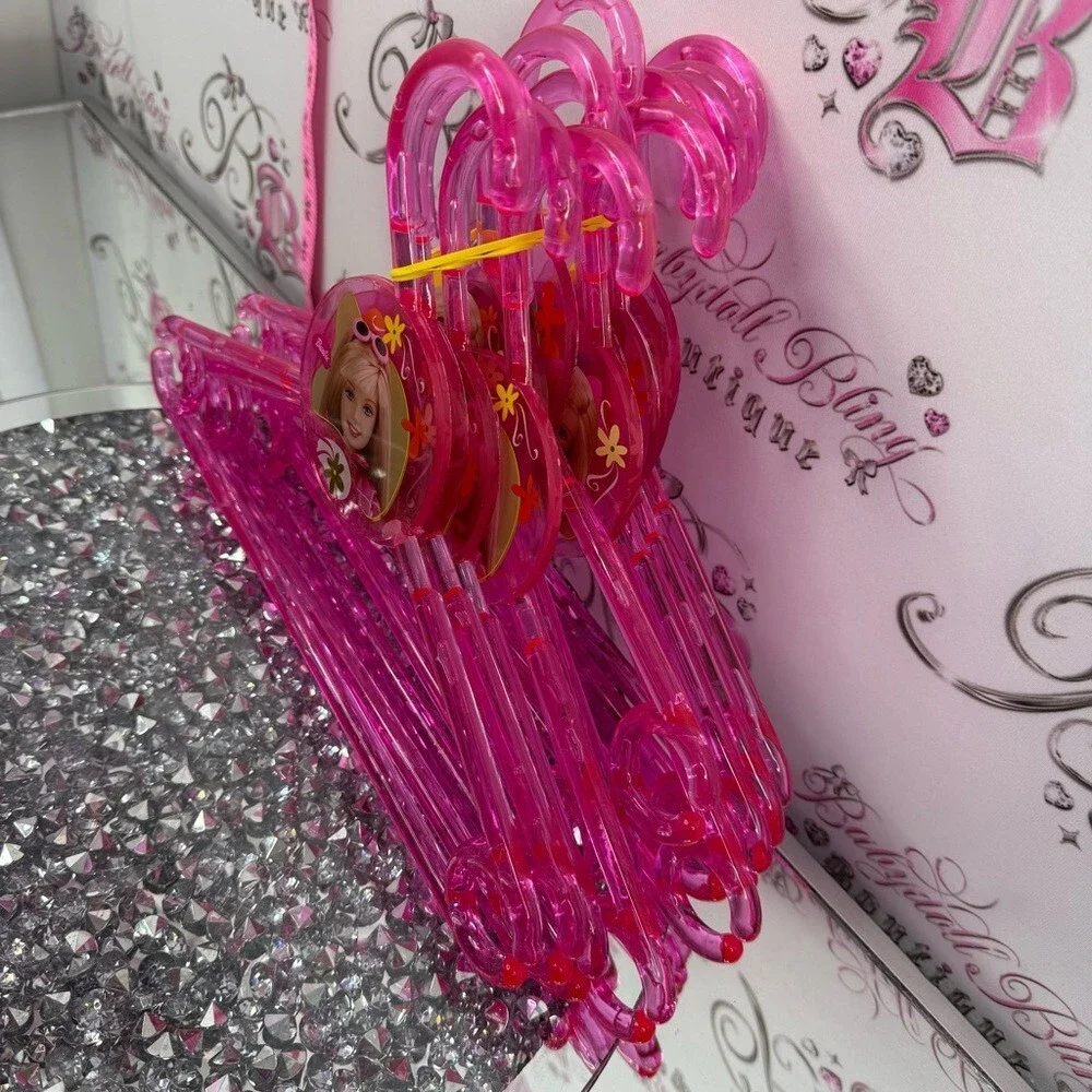 12 Barbie hangers 2001 Bright Pink acrylic Plastic Hangers with Character Accent